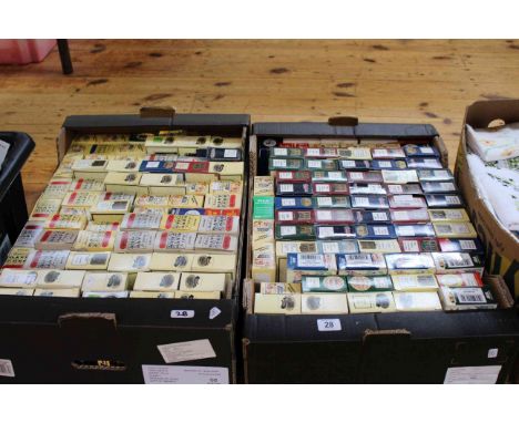 Two boxes of model vehicles