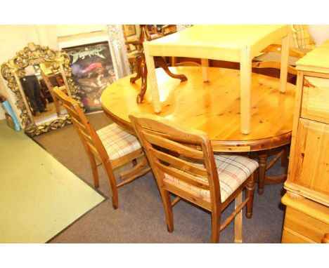 Oval pine extending dining table and four ladder back chairs