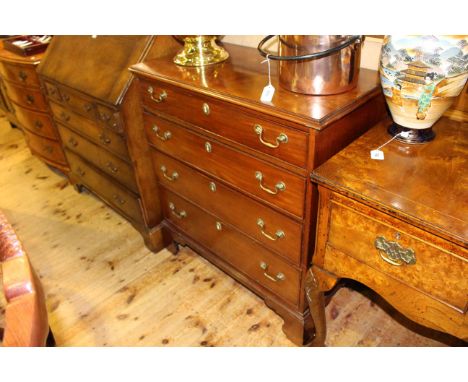 Georgian mahogany chest of four long graduated drawers on shaped bracket feet