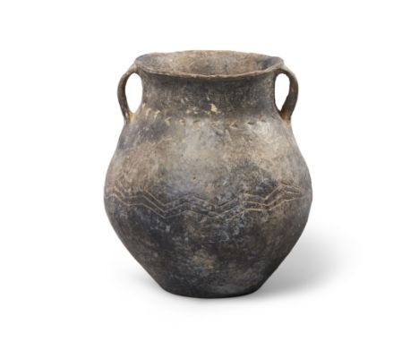 A Chinese Neolithic black burnished pottery jarPossibly Longshan culture, circa 2600-1900 BCWith paired loop handles and inci