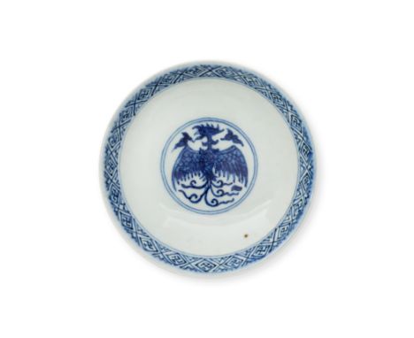A Chinese blue and white 'phoenix and lotus' dish20th century, apocryphal Wanli markPainted with two phoenixes amongst scroll