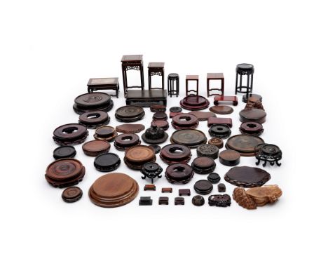 A collection of Chinese and Japanese carved hardwood stands and covers19th - 20th centuryComprising stands of various form an