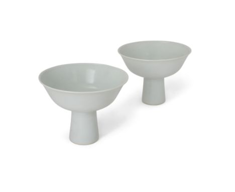 A pair of Chinese Ming-style tianbai-glazed anhua 'dragon' stem bowls20th century, apocryphal Yongzheng marksIncised to the i