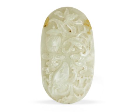 A Chinese jade 'lotus and carp' plaqueQing dynasty, 18th centuryThe oval plaque carved with a lotus flower to the top with st