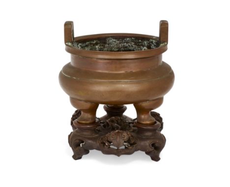 A Chinese copper tripod incense burnerQing dynasty, 19th centuryThe compressed globular body standing on three cabriole legs,