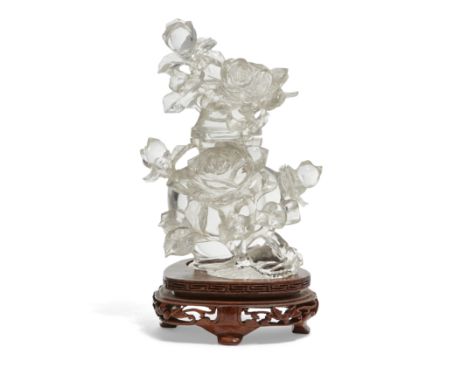 A small Chinese finely-carved ‘roses’ rock crystal vase and coverQing dynasty, 19th centuryDeeply carved in reticulation from