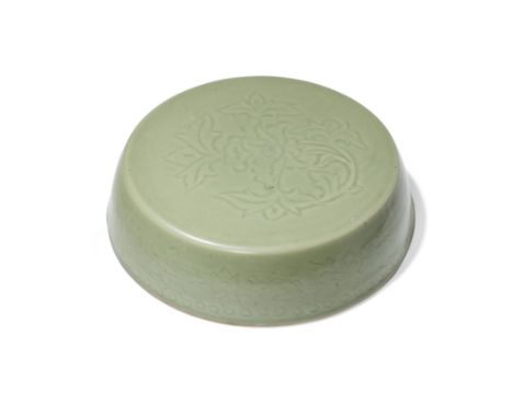 A Chinese Longquan celadon-glazed carved cover for a barrel-shaped boxMing dynasty, 16th centuryCarved to the top with a leaf