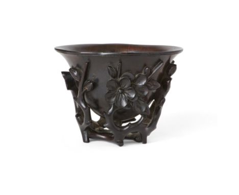 A Chinese zitan 'prunus and magnolia' cupQing dynasty, 17th/18th century Finely carved and pierced as a prunus flower head su