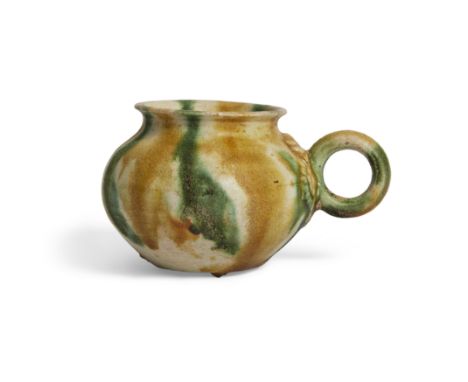 A Chinese sancai-glazed miniature handled jarletTang dynastyWith everted rim, the well-rounded shoulder flanked with a circul