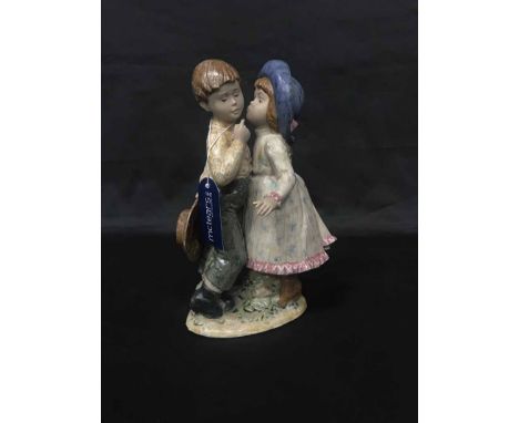 LLADRO FIGURE OF A BOY AND A GIRL along with two further Lladro figures of children in rocking chairs (3)