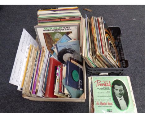 Two baskets containing a quantity of vinyl LPs and seven inch singles together with a quantity of sheet music  