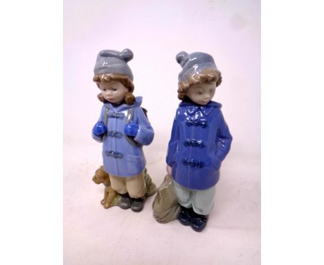 A Nao figure, first excursion, together with a further Nao figure, girl with backpack 