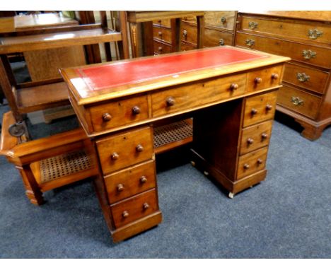 A Victorian mahogany child's desk fitted nine drawers with a red leather inset panel, width 96 cm 