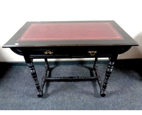 An Aesthetic Period ebonised writing table with a leather inset panel fitted a drawer, width 91 cm  