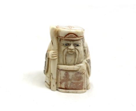 A Japanese carved bone netsuke - Village elder holding a scroll. 