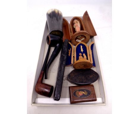 A box containing horn beaker, 19th century snuff boxes, religious figures in wooden cases, cut throat razor, pipes   