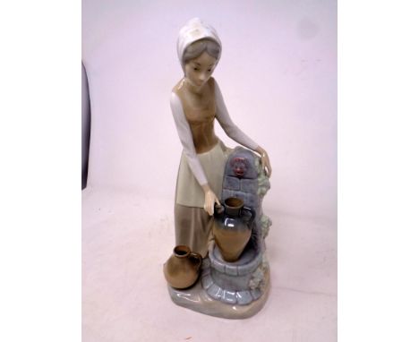 A Nao figure, girl at water well 