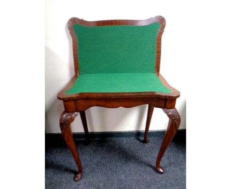A mahogany shaped turnover top card table on cabriole legs  