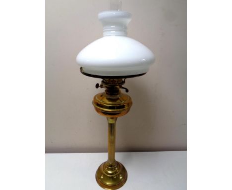 A Duplex brass oil lamp with opaque glass shade and chimney 