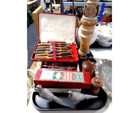 A tray containing cased plated and stainless steel cutlery, anniversary tray, pair of metal pheasant ornaments, wooden pepper