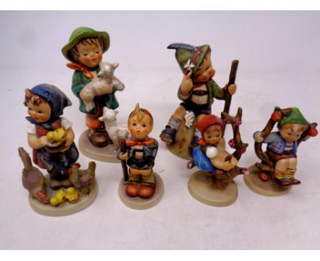 Six Goebel and Hummel figures to include Mountaineer, Apple Tree Boy, Feeding Time etc 