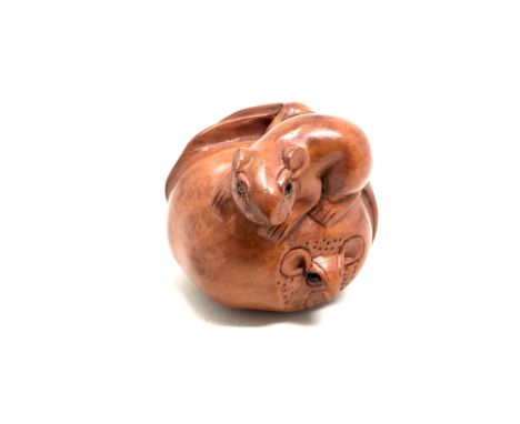 A Japanese carved fruitwood netsuke -  Rats on a pumpkin. 