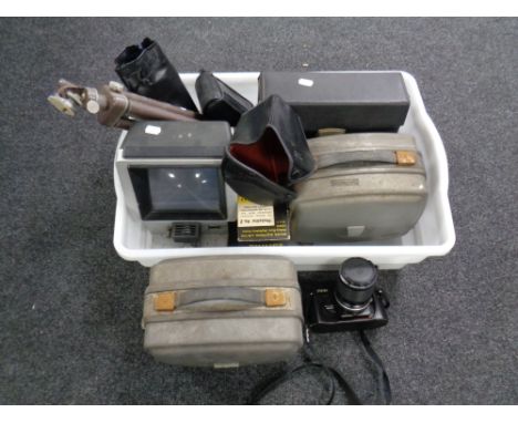 A box containing Nikon FG-20 camera with lens, camera tripods, slide viewers, projectors etc 