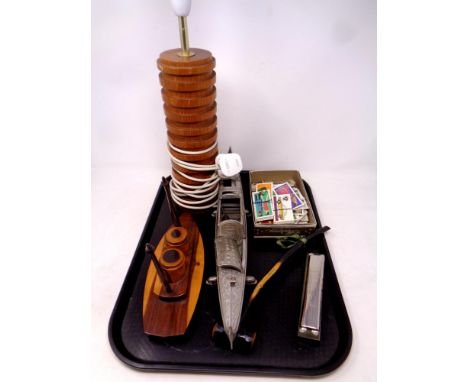 A tray containing miscellaneous to include 20th century teak table lamp and desk stand, Hohner harmonica, tea cards, together