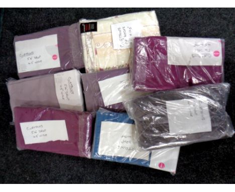 A box containing a quantity of curtains 