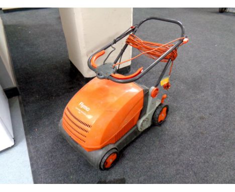 A Flymo Lawnrake compact 340 with lead  