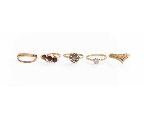 Five 9 Carat Gold Rings, comprising of an amethyst example, finger size P1/2; a cubic zirconia example, finger size O; a garn