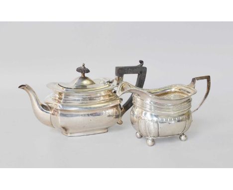 A George III Silver Cream-Jug, by Peter and William Bateman, London, 1812, oblong and on four ball feet, with gadrooned borde