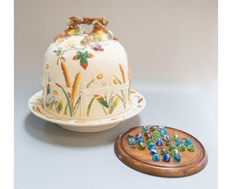 A Victorian George Jones Pottery Cheese Dome and Stand, moulded and decorated in overglaze enamel, with wild fruit and flower
