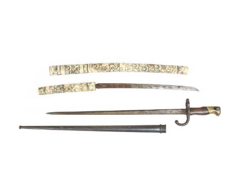 A French M1874 Gras Bayonet, the T section steel blade engraved Mre d'Armes de St Etienne, Juin 1878, with steel scabbard; a 