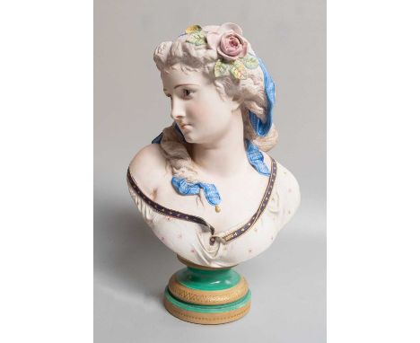 A Limoges Bisque Porcelain Bust, by Henri Ardant, modelled after A. Carrier, as a maiden with a ribbon and rose in her hair, 