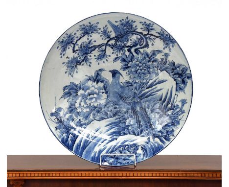 A 20th Century Japanese Charger, painted in underglazed blues with an exotic bird, 63cm diameterFiring imperfections but othe