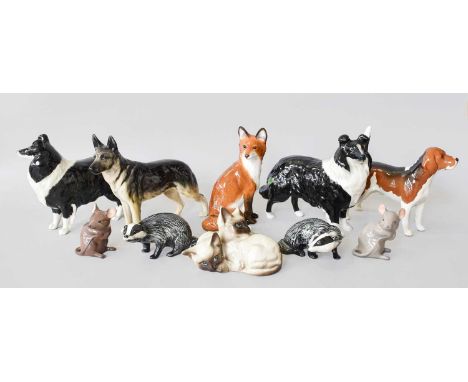 Beswick Dog and Wildlife Models, including collies, labrador, boxer, badgers, a fox, etc and two Beswick tree trunk display s