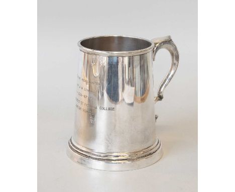 An Elizabeth II Silver Mug, by Viners Ltd., Sheffield, 1965, tapering and on spreading foot, with leaf-capped handle, engrave
