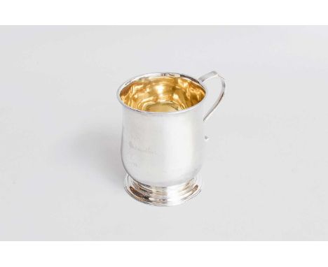 A George V Irish Silver Mug, by West and Son, Dublin, 1910, in the George III style, baluster and on stepped foot, with scrol