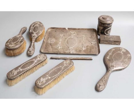 An Edward VII Silver Dressing-Table Service, by William Comyns, London, 1905, 1908 and 1909, each piece with Neo-classical st