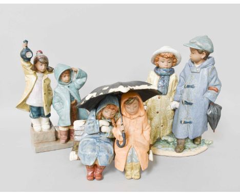 Three Lladro Figures, comprising: two figures seated beneath an umbrella and two figures in winter dress (3)Overall good cond