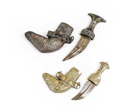 A Mid-20th Century Arab Khanjar, the 13cm double edge curved steel blade with raised medial ridge, the waisted horn grip with
