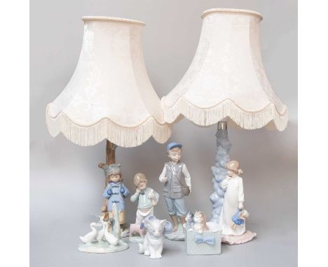 A Pair of Nao Porcelain Table Lamps and three other Nao figures (one tray)