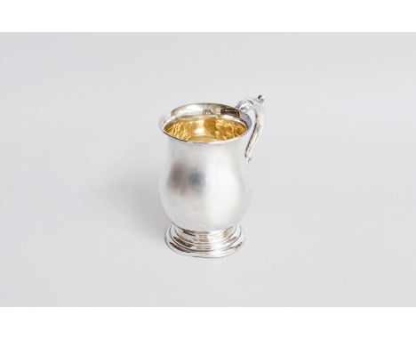 A George V Silver Mug, by Alexander Clark and Co. Ltd., Birmingham, 1922, in the George III style, baluster and on stepped fo