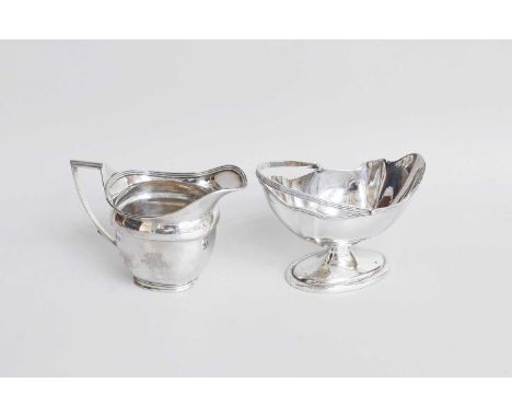 A George III Silver Cream-Jug, by John Emes, London, 1807, helmet-shaped and with reeded rim, engraved with initials, 95mm hi