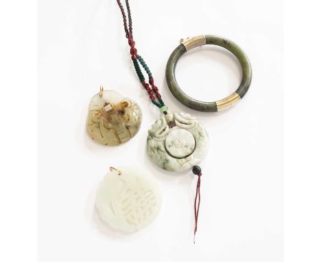 A Nephrite Hinged Bangle, inner diameter 6.2cm; A Nephrite Pendant, diameter 5.5cm (a.f.); and Two Jade Pendants, diameters 5