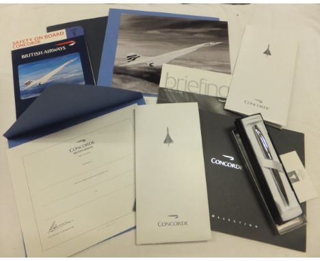 A collection of Concorde memorabilia, including cross pen luggage tags, photographs, briefing magazine August 2003, Concorde 