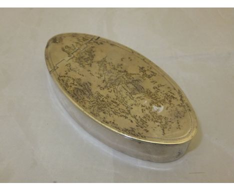 A George III silver snuff box of oval form, the hinged lid with engraved decoration and armorial depicting an armoured arm ho