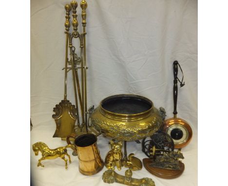 A box of assorted metal wares to include fire tools, Bonzo decorated trivet, copper tankard, various brass figurines, etc