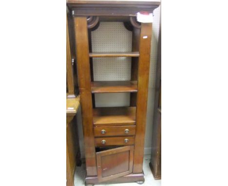 A mahogany three shelf display cabinet above two drawers and cupboard door below